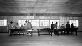 General William K. Harrison, Jr., seated at left, and North Korean General Nam Il, seated at right, sign armistice documents in Armistice Hall in Panmunjom, a no-man's-land between the Koreas. The 1953 Korean armistice agreement did stop the fighting, but no final peace treaty was signed.