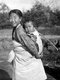 Korea: A girl carrying a child on her back, Heijo (Pyongyang), Korea, 1939
